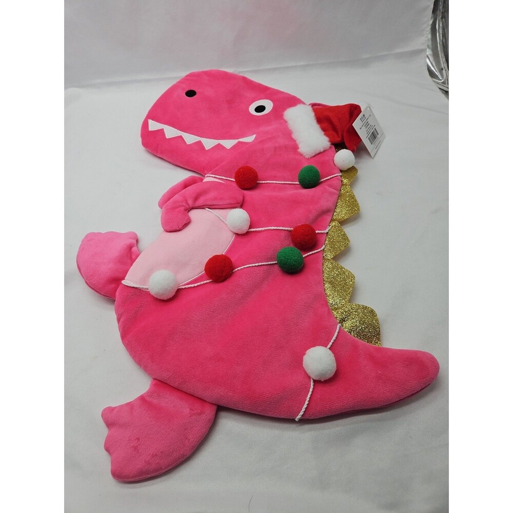 Pink Dinosaur Holiday Stocking With Hat & Garland On It.